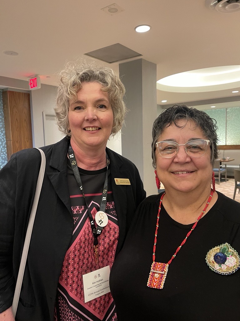 Elder Denise McCuaig receiving her award