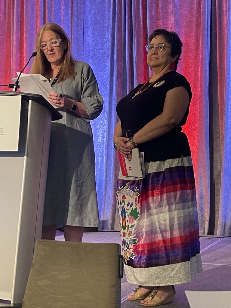 Attendees honouring Elder Denise McCuaig