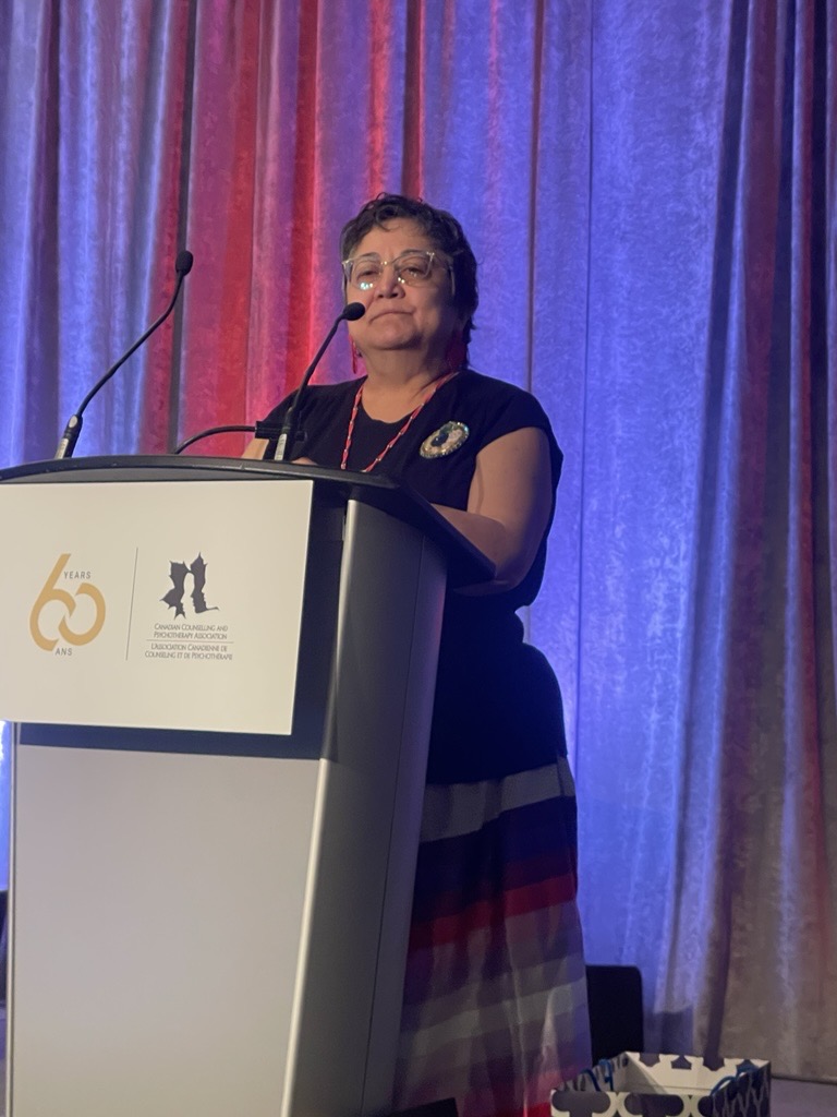 Elder Denise McCuaig speaking at the event